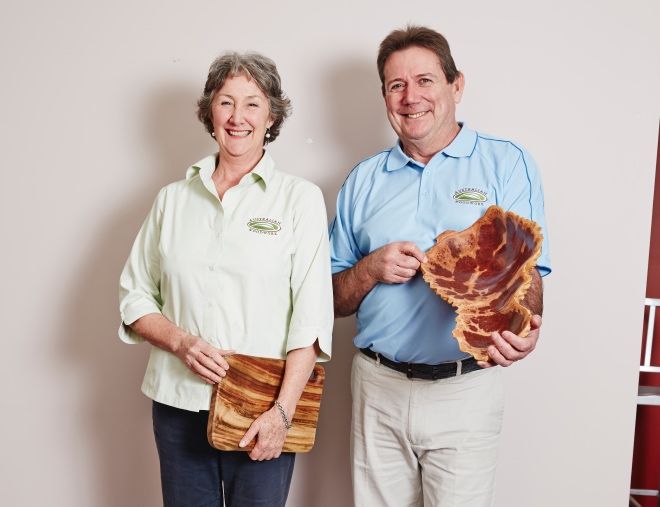 Australian Woodwork's founders, Sarah and Greg, showing off handcrafted bowls.